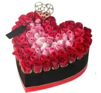 70 stems of roses in a heart box