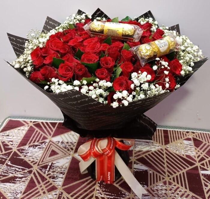 Bouquet of red flowers and ferrero chocolates