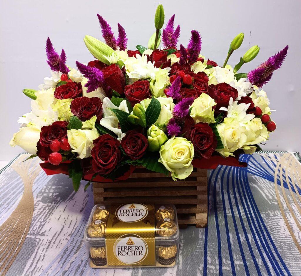 Basket of flowers and box of Ferrero chocolates