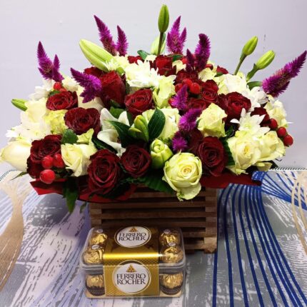 Basket of flowers and box of Ferrero chocolates