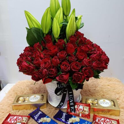 Bouquet of red roses and assorted chocolates