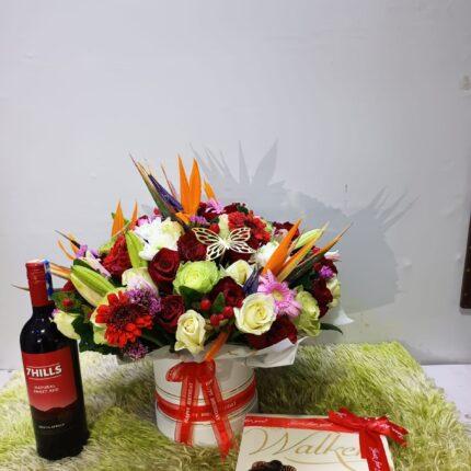 Flowers in a Vase, Red Wine and Walkers Chocolates