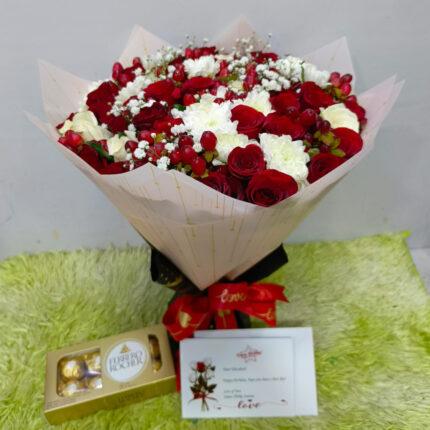 Luxury flower bouquet with Ferrero Rocher chocolates and red ribbon gift wrap